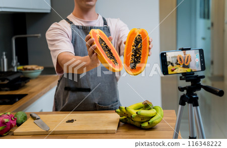 The chef is broadcasting live from workshop how to cuts and peels papaya The chef is broadcasting live from workshop how to cuts and peels papaya 116348222