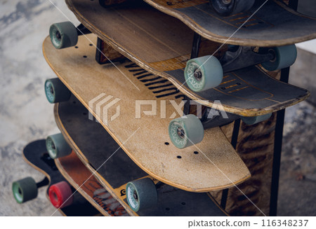 A stack of skateboards on a special outdoor stand 116348237