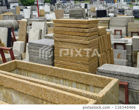 A collection of concrete tile is arranged on one another 116348466