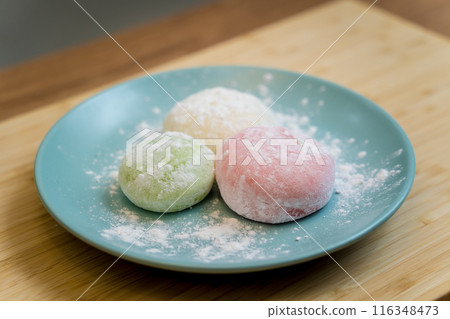 Different color delicious Japanese mochi on the blue plate Different color delicious Japanese mochi on the blue plate 116348473
