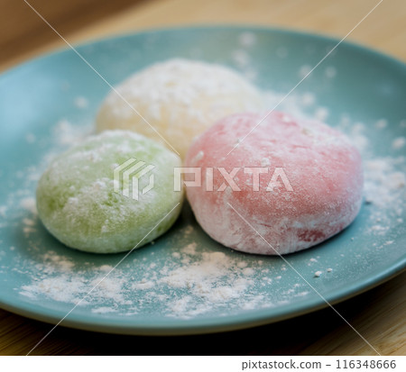 Different color delicious Japanese mochi on the blue plate Different color delicious Japanese mochi on the blue plate 116348666