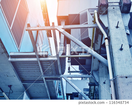 Ventilation pipes on the top of large industrial building Ventilation pipes on the top of large industrial building 116348734