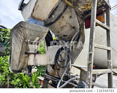 A concrete mixer truck parked beside of a concrete factory A concrete mixer truck parked beside of a concrete factory 116348783