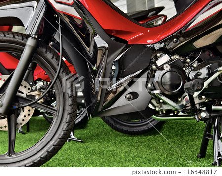 Detailed view of a motorcycle wheels and brakes 116348817