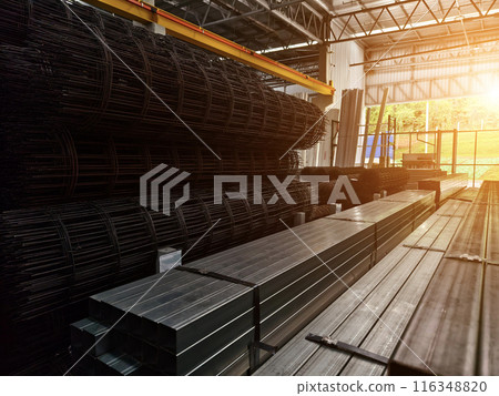 A big warehouse packed with numerous metallic nets and profile 116348820