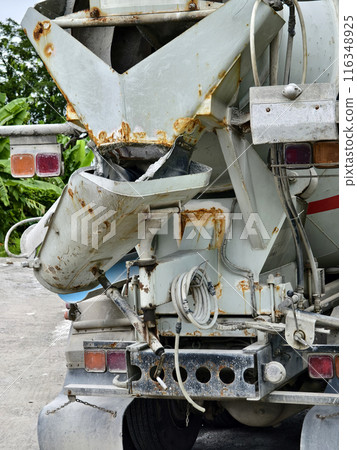 A concrete mixer truck parked beside of a concrete factory A concrete mixer truck parked beside of a concrete factory 116348925