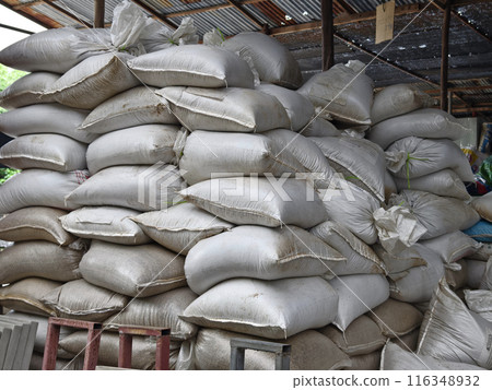 Stacking of big white bags in the modern warehouse Stacking of big white bags in the modern warehouse 116348932