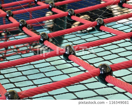 The trampoline features a mazepatterned surface for recreational use indoors The trampoline features a mazepatterned surface for recreational use indoors 116349081