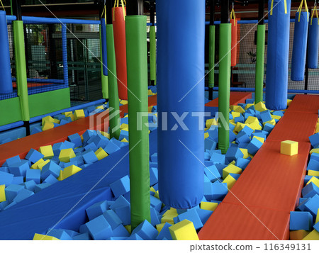 Trampoline park has blue and yellow foam cubes for kids fun Trampoline park has blue and yellow foam cubes for kids fun 116349131