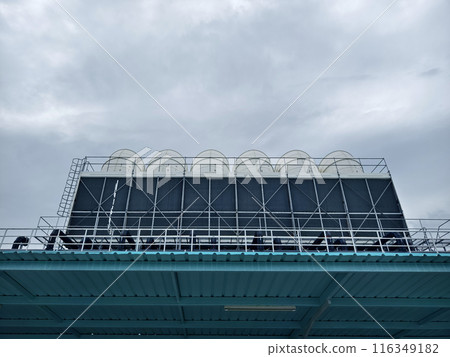 Ventilation pipes on the top of large industrial building 116349182