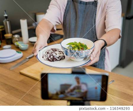 The chef is broadcasting live from workshop how to prepare a vegetarian green curry 116349293