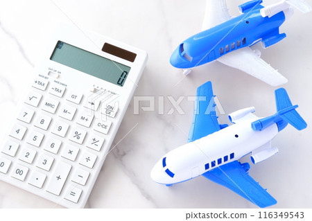 Calculator and airplane, image of rising airfares and soaring travel costs 116349543