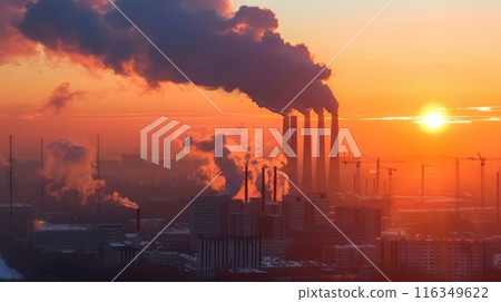 A large industrial plant is spewing smoke into the air A large industrial plant is spewing smoke into the air 116349622