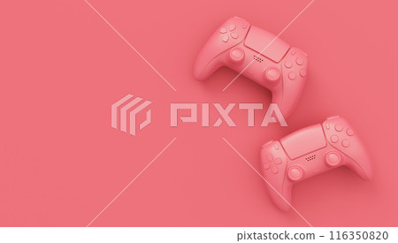 Video game joysticks or gamepads in plain monochrome pink color background 116350820