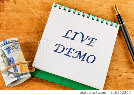 Business and Live Demo concept. Copy space. Concept word Live Demo on a blank sheet of notepad against a papyrus background Business and Live Demo concept. Copy space. Concept word Live Demo on a blank sheet of notepad against a papyrus background 116352263