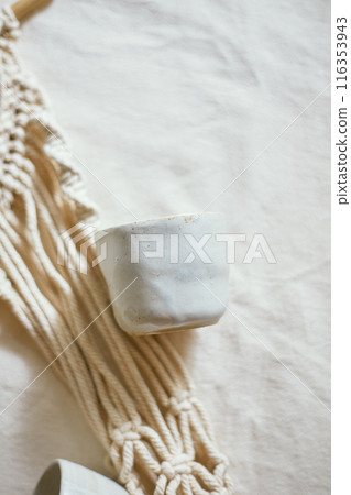 Ceramic cup on a textile Ceramic cup on a textile 116353943