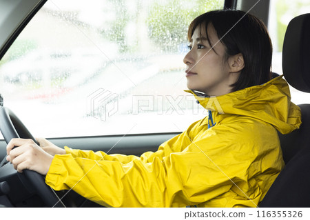 Woman driving on a rainy day Woman driving on a rainy day 116355326