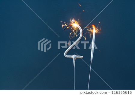 21 years celebration festive background made with Bengal fires in the form of number Twenty-one. 21 years celebration festive background made with Bengal fires in the form of number Twenty-one. 116355616