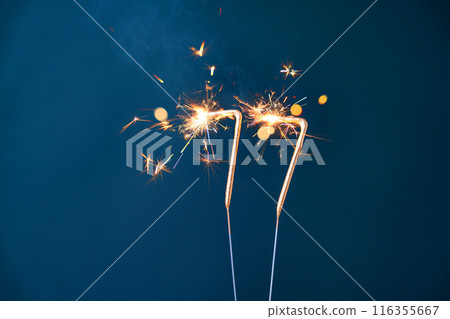77 years celebration festive background made with Bengal fires in the form of number Seventy-seven. 77 years celebration festive background made with Bengal fires in the form of number Seventy-seven. 116355667