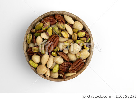 mix of peeled nuts in wooden bowl isolated on white mix of peeled nuts in wooden bowl isolated on white 116356255