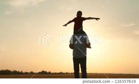 silhouette father carrying child boy his shoulders sunsethappy family, family outdoor activity, child piggyback father, bonding family silhouette., father and son play, childhood adventure piggyback silhouette father carrying child boy his shoulders sunsethappy family, family outdoor activity, child piggyback father, bonding family silhouette., father and son play, childhood adventure piggyback 116357619