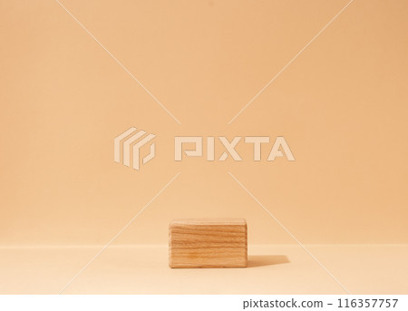 A mockup scene showcasing beauty cosmetics products, set on textured wooden cube podium against a beige background. Captured in a studio setting. 116357757