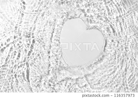 Cosmetic Product Presentation Mockup Featuring an Empty Heart-Shaped Space on a Water Surface with Splashes. Perfect for Highlighting Freshness and Natural Purity in Product Placement. 116357973