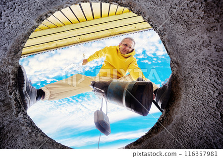 Before cleaning septic tank, homeowner floods sewer pump in well to pump out waste water. Before cleaning septic tank, homeowner floods sewer pump in well to pump out waste water. 116357981