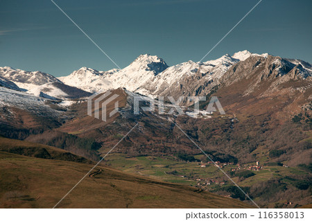 Obeso town with the snowy mountains around it- 116358013