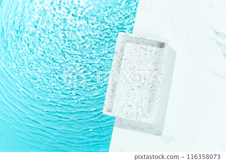 Minimalist cosmetics product presentation mockup scene made with mosaic tray adorned with blue water, creating a sleek and elegant visual appeal. Perfect for showcasing beauty products. Minimalist cosmetics product presentation mockup scene made with mosaic tray adorned with blue water, creating a sleek and elegant visual appeal. Perfect for showcasing beauty products. 116358073