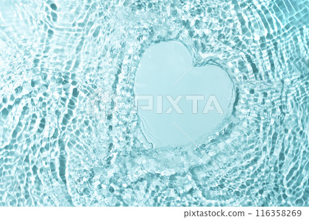 Cosmetic product presentation mockup scene made with empty place on water surface in a shape of heart made with splashes. Ideal for product placement with an emphasis on freshness and natural purity. 116358269