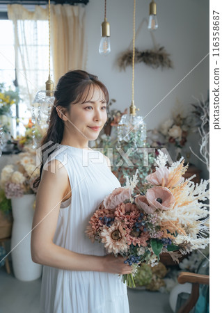 Fashion portrait of a woman wearing a dress 116358687