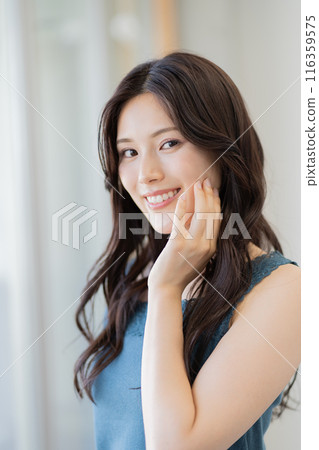 Beauty image of a woman in her 20s (long black hair, sleeveless) Beauty image of a woman in her 20s (long black hair, sleeveless) 116359575