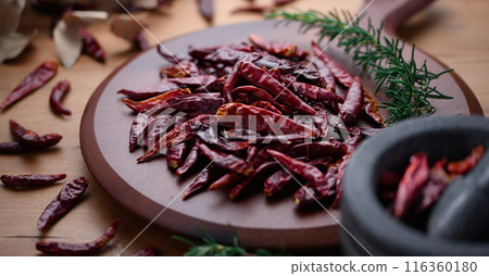 Chili peppers on a cutting board 116360180