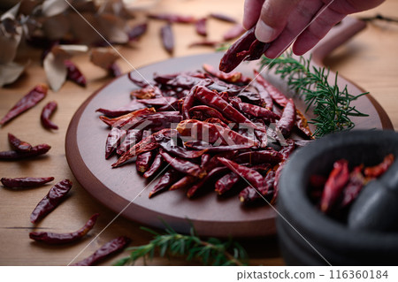 Chili peppers on a cutting board 116360184
