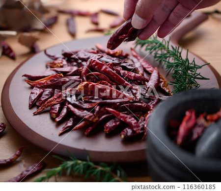 Chili peppers on a cutting board 116360185