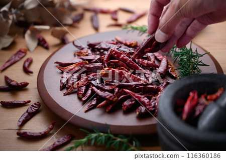 Chili peppers on a cutting board 116360186