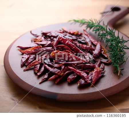 Chili peppers on a cutting board Chili peppers on a cutting board 116360195