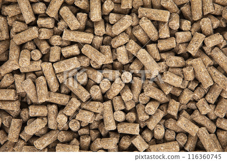 Dry brown pet food background forming a texture 116360745
