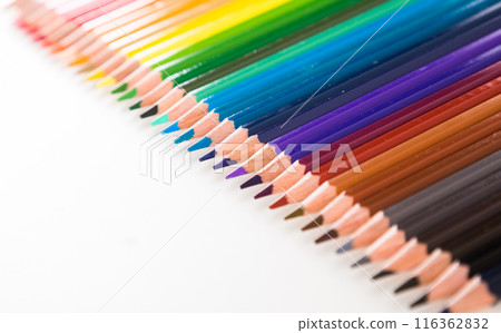 Colored pencils lying in row 116362832