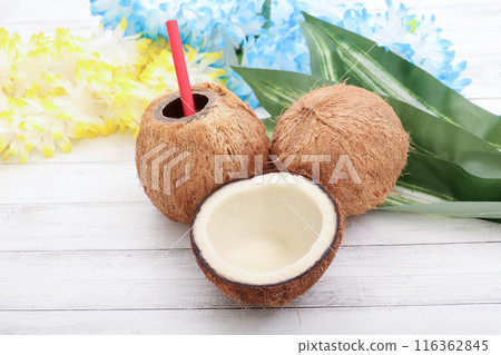Coconuts on a white wooden table 116362845