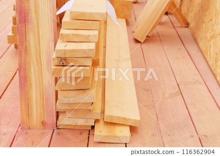 Storage of new wooden planks. Wooden planks on construction site. Construction of a wooden terrace. Storage of new wooden planks. Wooden planks on construction site. Construction of a wooden terrace. 116362904
