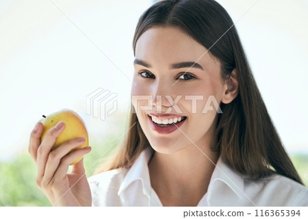 Dental Care And Healthy Lifestyle. Woman Holding Apple Enjoying Healthy Lifestyle Outdoors 116365394