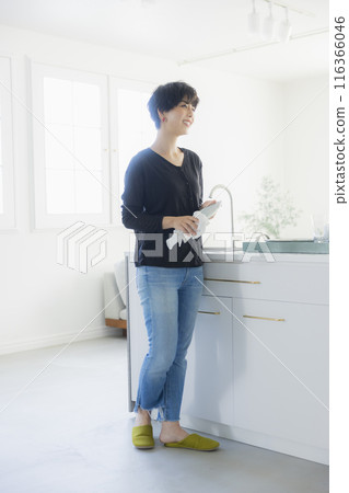 Woman in the kitchen Woman in the kitchen 116366046