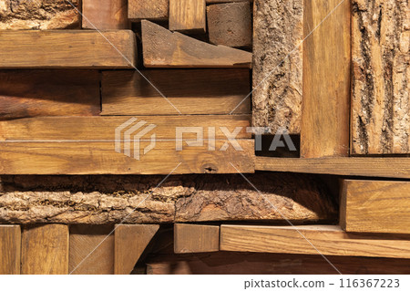 Decorative wooden wall made of small planks Decorative wooden wall made of small planks 116367223