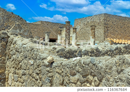 View of the historic ruined city of Pompeii in Italy with the volcano Vesuv View of the historic ruined city of Pompeii in Italy with the volcano Vesuv 116367684