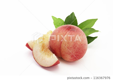 A popular summer fruit, peach, served with leaves on a white background 116367976
