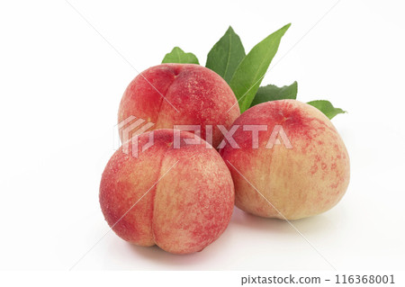 A popular summer fruit, peach, served with leaves on a white background A popular summer fruit, peach, served with leaves on a white background 116368001