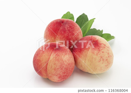 A popular summer fruit, peach, served with leaves on a white background A popular summer fruit, peach, served with leaves on a white background 116368004