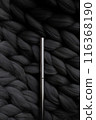 Mascara on a background of a gray merino wool blanket 116368190